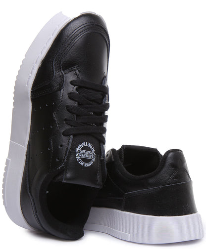 Adidas Supercourt J Chaussures de sport en cuir à lacets pour jeunes en noir et blanc